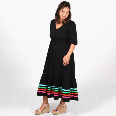 Colourful Ribbon Hem Dress With 5 Rows Against A Black Background - From Source Lifestyle